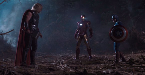 In <em>The Avengers</em>, what hits Captain America's shield, resulting in the flattening of the forest surrounding him?